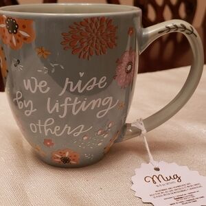 WE RISE BY LIFTING OTHERS COFFEE MUG